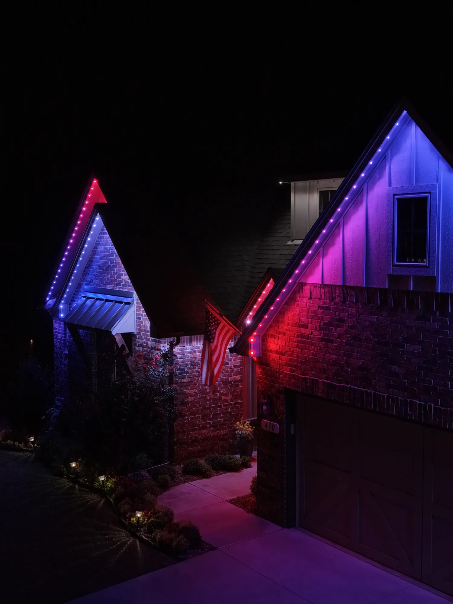 Gable peak running blue and red. Permanent Lighting by LIT Outdoor Lighting in Tulsa.