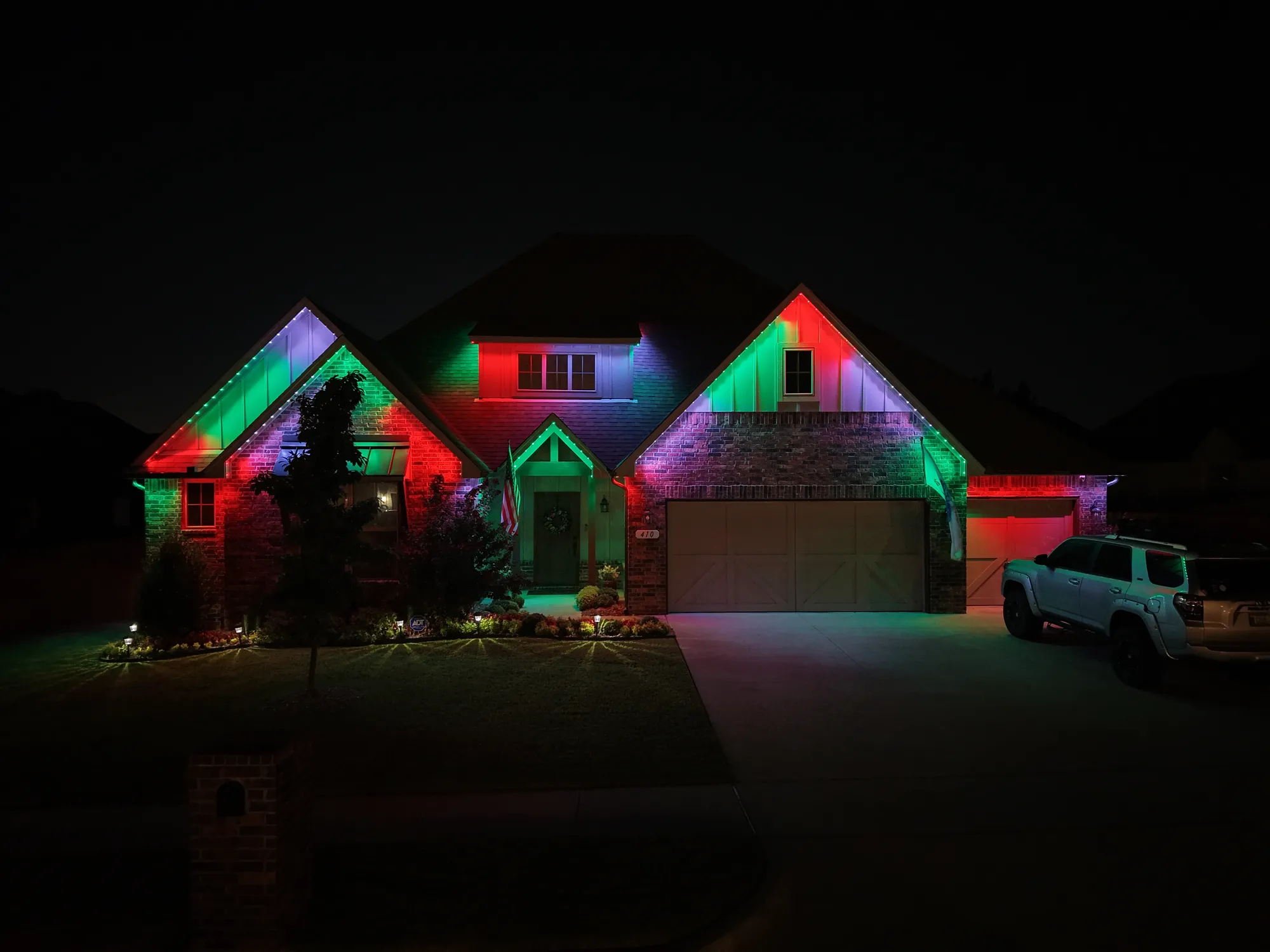 Gables lit red and green. Permanent Lighting by LIT Outdoor Lighting in Tulsa.