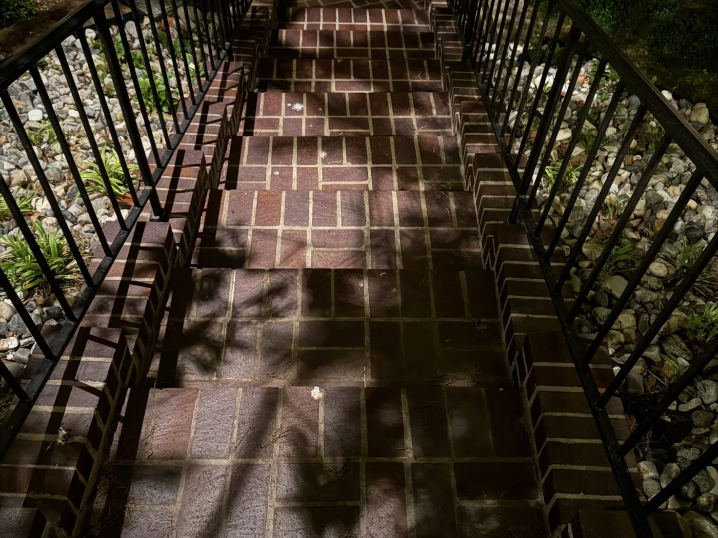 Stone steps and a lit walk. Landscape Lighting by LIT Outdoor Lighting in Tulsa.