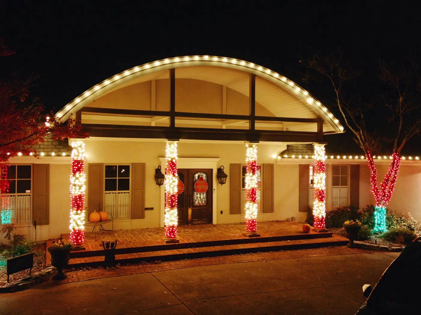 Garland up the columns of a portico. Christmas Lighting by LIT Outdoor Lighting in Tulsa.